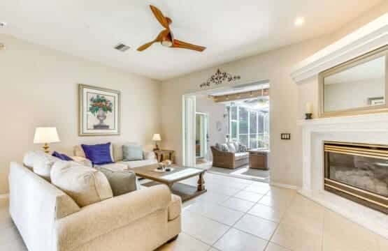 Lounge and fireplace at The Restful Vacation’s Golf and Pool Home.